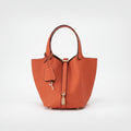 Women's Structured Bucket Bag with Twist-Lock Clasp - Fresh Orange Ember